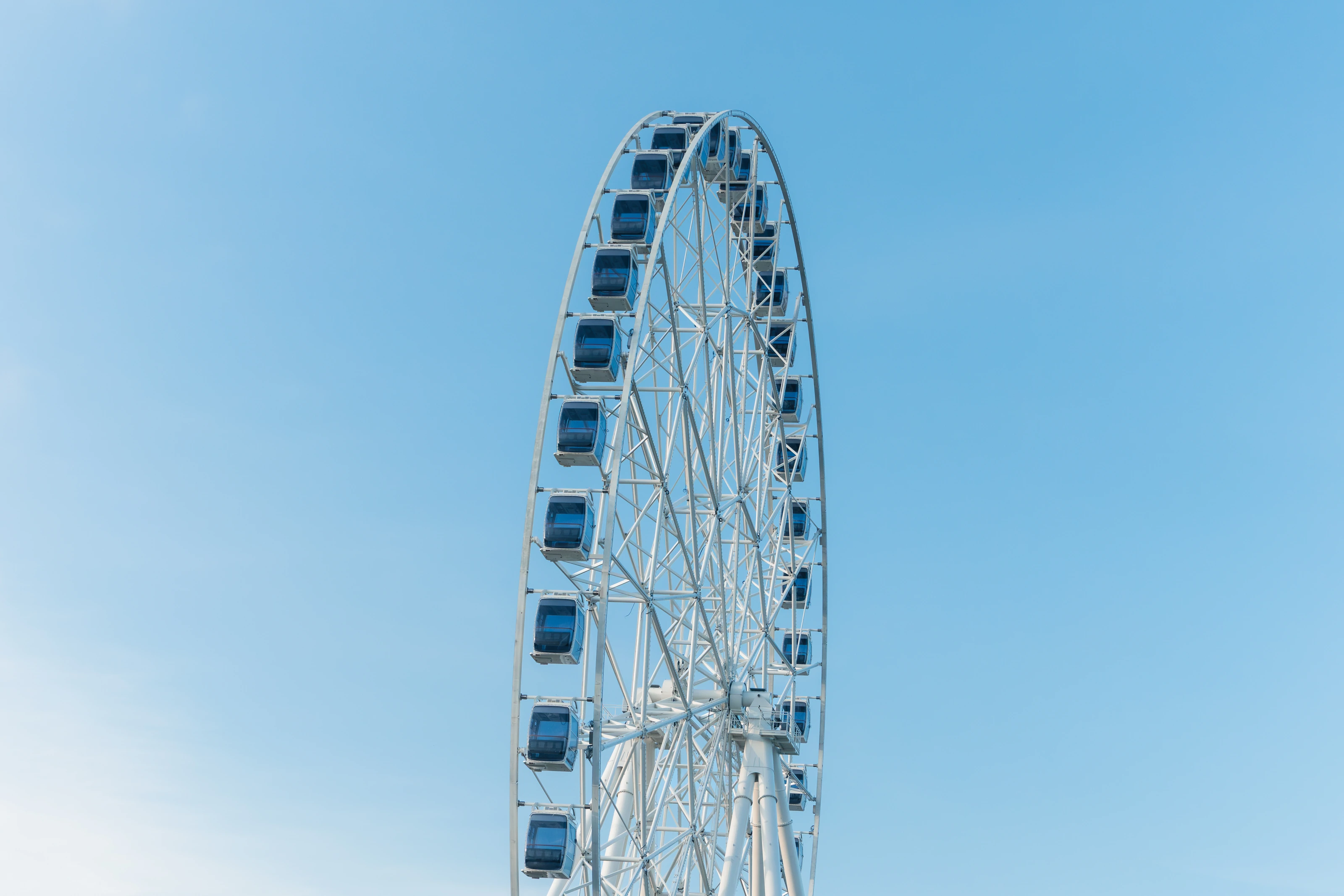 A Ferris wheel against a blue sky