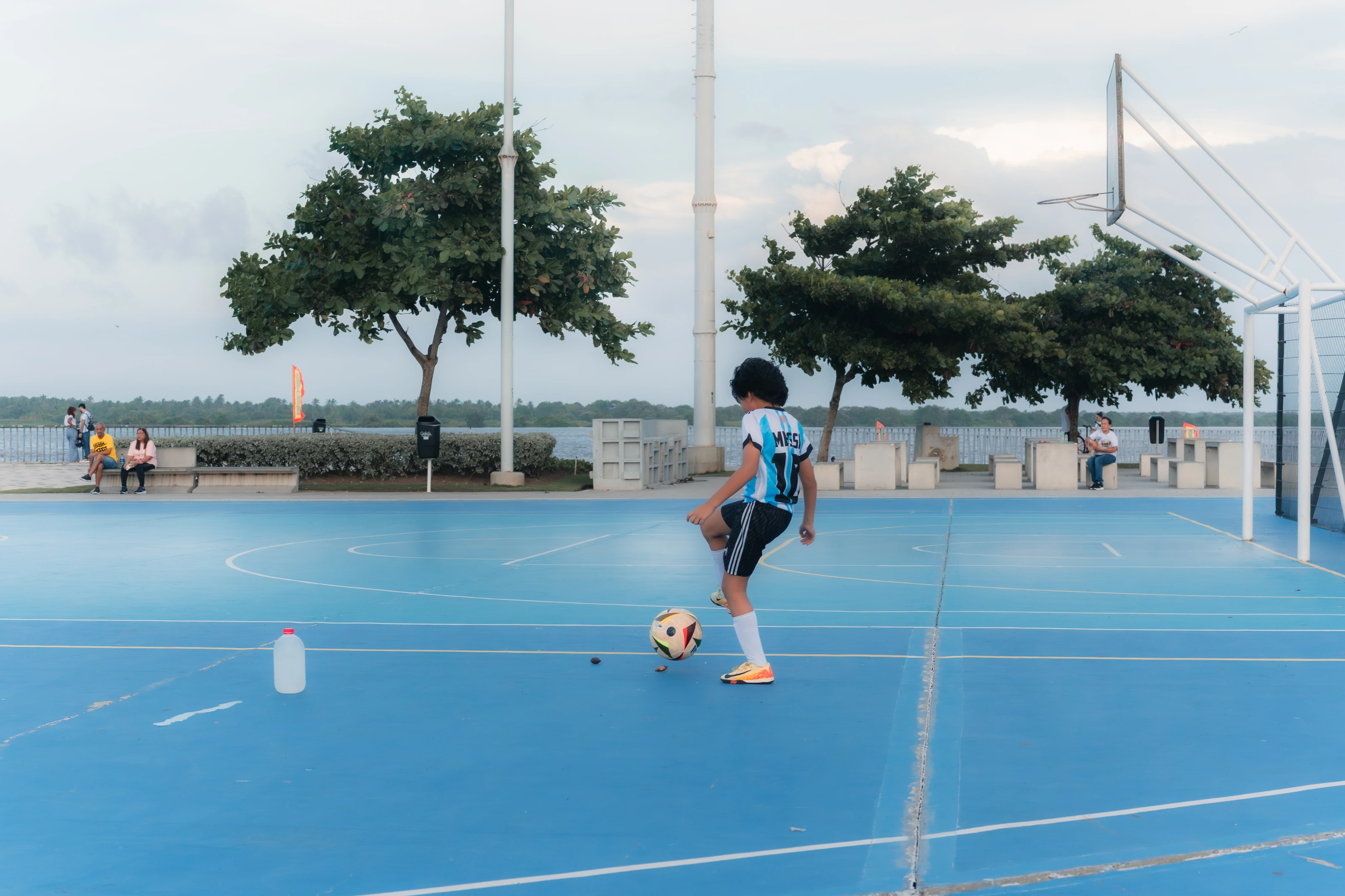 A tennis player on a blue court