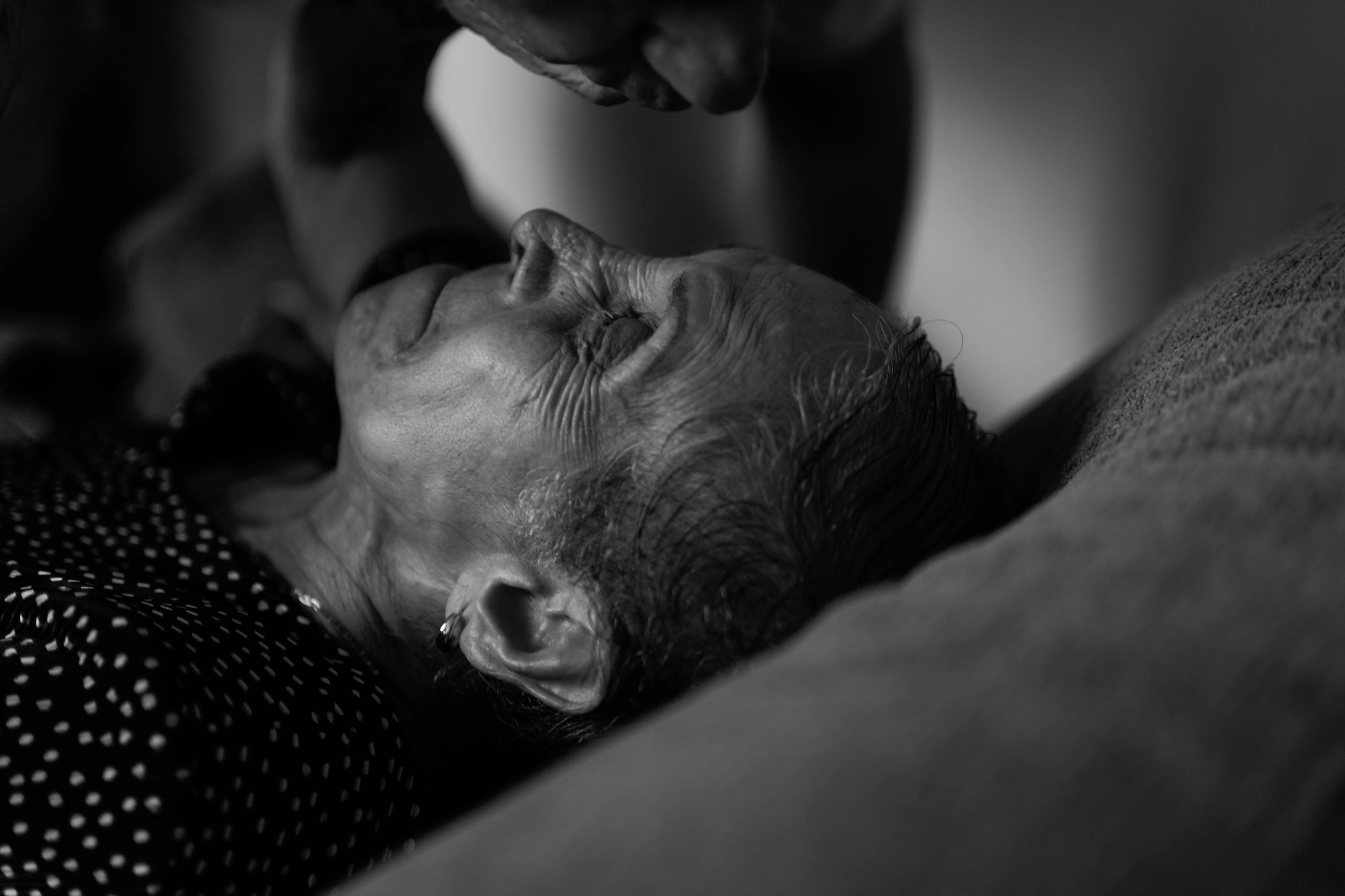 An intimate black and white portrait in repose
