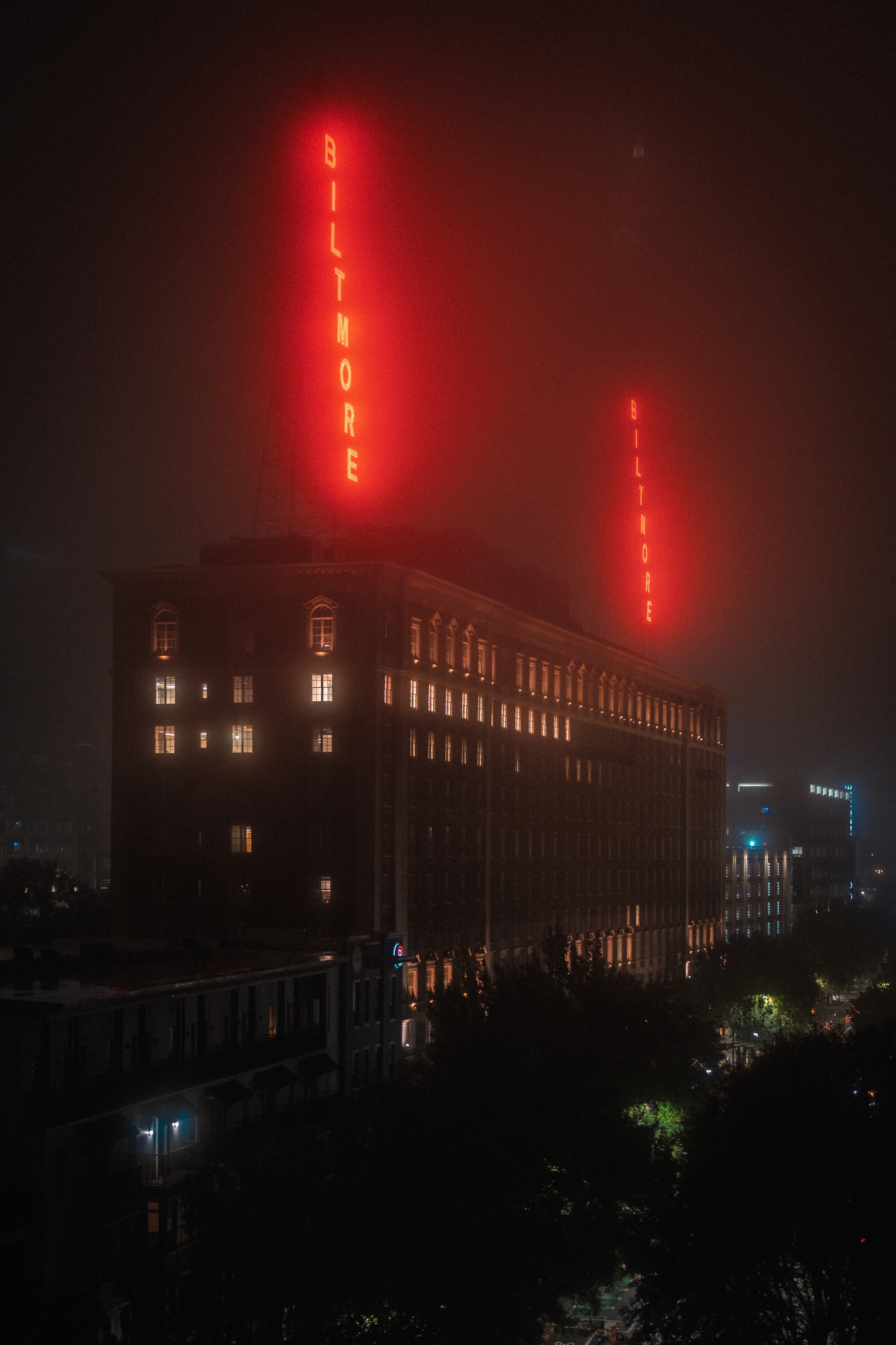Red light above a city building at night